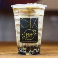 Hokkaido Tiger Coffee Milk Tea · Our Coffee Milk Tea lined with creamy Tiger Walls, brown sugar boba, and topped with flavorf...