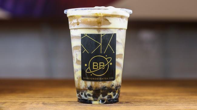 Hokkaido Tiger Coffee Milk Tea · Our Coffee Milk Tea lined with creamy Tiger Walls, brown sugar boba, and topped with flavorful Dalgona whipped coffee