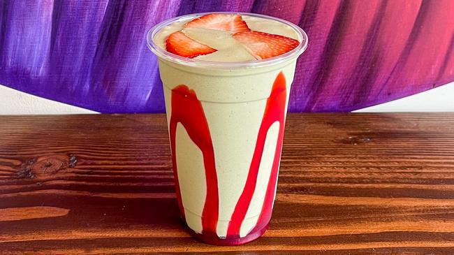 Berry Matcha Smoothie · Creamy blended strawberry jam and matcha paired with sweet strawberry walls and fresh diced strawberry garnish