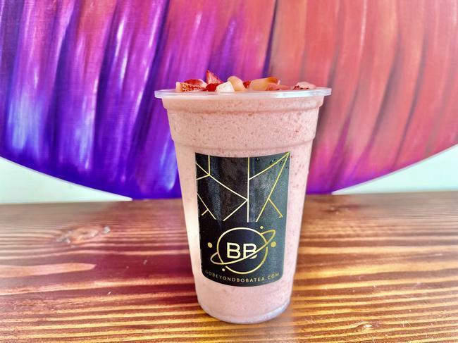 Strawberry Banana Smoothie · Real bananas blended with strawberry jam made from real strawberries and complete with diced strawberries on top.
