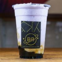 Ube Smoothie · Slightly nutty and sweet ube flavor ice-blended with milk and layered over brown sugar boba
