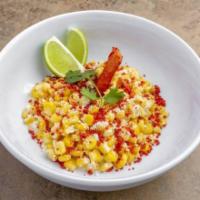Street Corn on the Esquite · Butter sautéed corn in a cup with mayonnaise cotija cheese dusted with ground Takis and garn...
