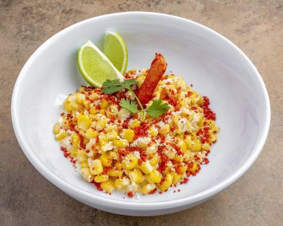 Street Corn on the Esquite · Butter sautéed corn in a cup with mayonnaise cotija cheese dusted with ground Takis and garnished with cilantro leaf