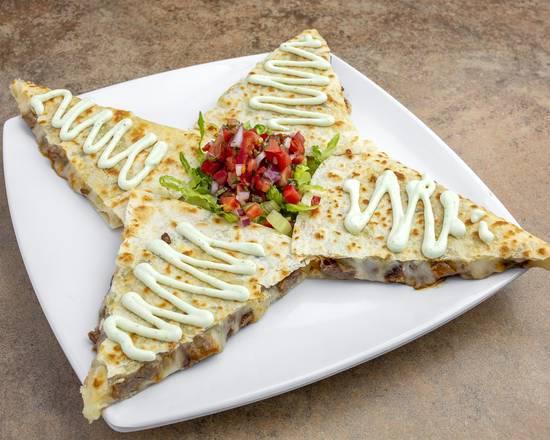 Super Quesadilla · Flour tortillas with cheese and your choice of chicken, steak, or pork with a side of  cilantro infused sour cream 