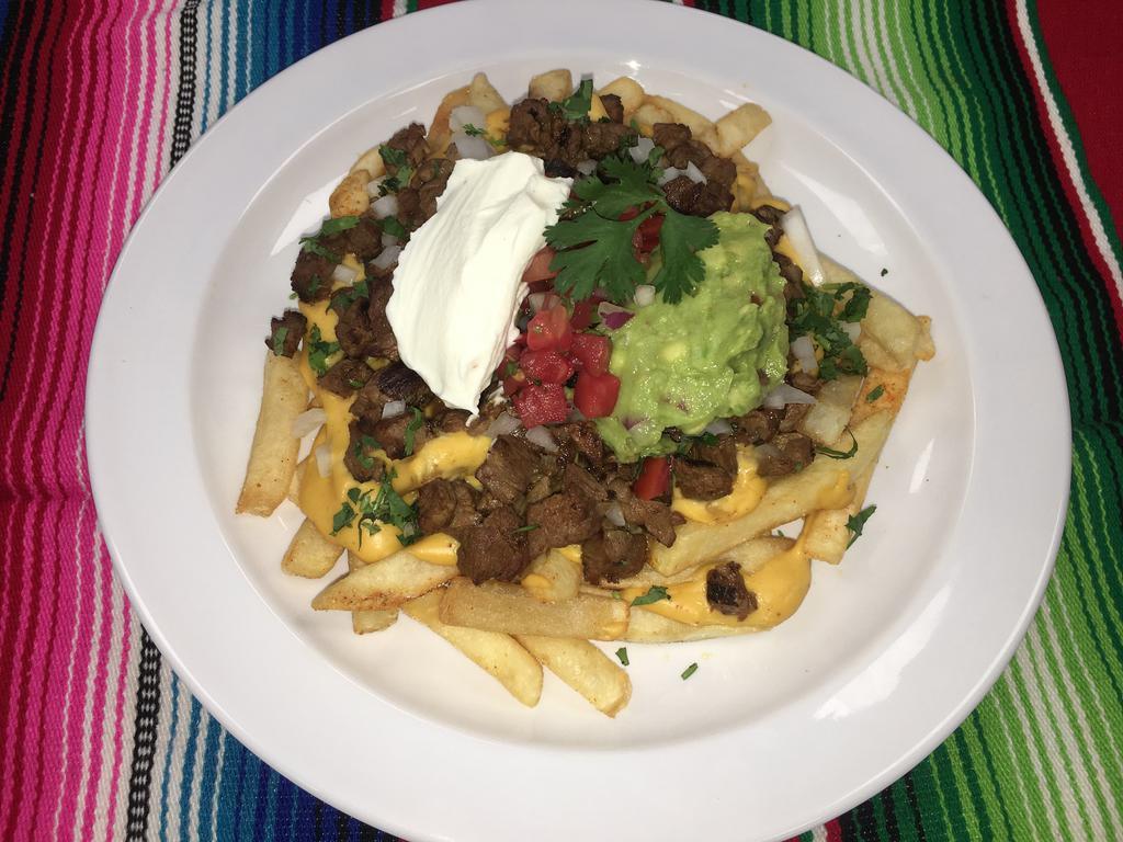 Loaded Steak Fries  · Crispy french fries, in-house cheddar cheese sauce, your choice of chicken, por, or steak, onion, cilantro, sour cream, guacamole, and pico de gallo
