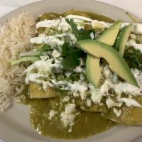 Enchiladas Verdes de Pollo · Mozzarella cheese chicken wrapped in corn tortilla and drizzled w/ green salsa and topped wi...