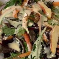 Green leave salad  · Mix greens, sweets walnuts, shaved carrots, red onions, goat cheese, and sliced apples. hone...