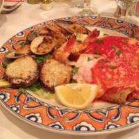 Hot Antipasto  · Baked clams, eggplant rollatini and shrimp oreganata. 