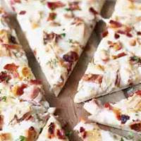 Bacon Chicken Ranch Pizza · Mozzarella cheese, maple grazed bacon and chopped tomatoes topped with cheddar and ranch dre...