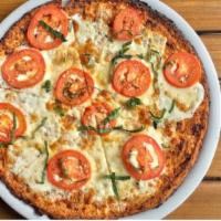 Pomodoro Pizza · Topped with sliced fresh tomatoes, mozzarella cheese, imported olive oil, and fresh basil. 