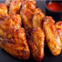 BBQ Chicken Wings · Fresh oven-baked chicken wings smothered in sweet tangy barbeque sauce.