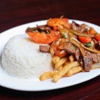 Lomo Saltado · Sliced beef sauteed with onions, tomatoes and cilantro with rice and fries.