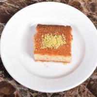 Hariseeh · A semolina honey cake, drizzled with sweet Qater sauce and then garnished with pistachio. Ma...