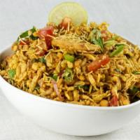 Bhel Puri · This savory snack mix includes puffed rice, puri and traditional chutneys.