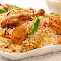 Chicken Biryani · Hearty rice loaded with tender chicken, hearty vegetables and fresh spices. Gluten free.