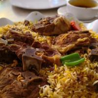 Goat Biryani · Hearty rice loaded with tender goat, hearty vegetables and fresh spices. Gluten free.