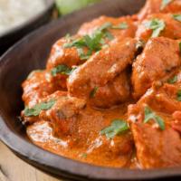 Chicken Tikka Masala · Tender white meat chicken cooked in a creamy tomato based curry flavored with fresh traditio...