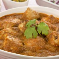 Chicken Vindaloo · Tender white meat chicken and hearty potatoes served in a traditional Indian curry accompani...