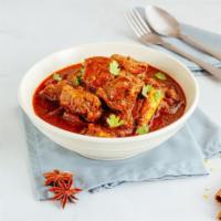 Lamb Vindaloo · Tender lamb and hearty potatoes served in a traditional Indian curry accompanied with a side...