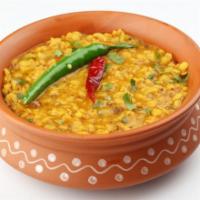 Yellow Dal · Tender lentils stewed in a savory curry and served with a side of basmati rice. Gluten free.