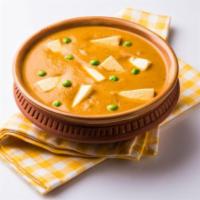 Matar Paneer · Traditional Indian cheese, peas and onions cooked in a savory sauce and served with a side o...