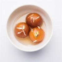 2 Piece Gulab Jamun · Traditional Indian donut holes soaked in sweet rose water syrup.