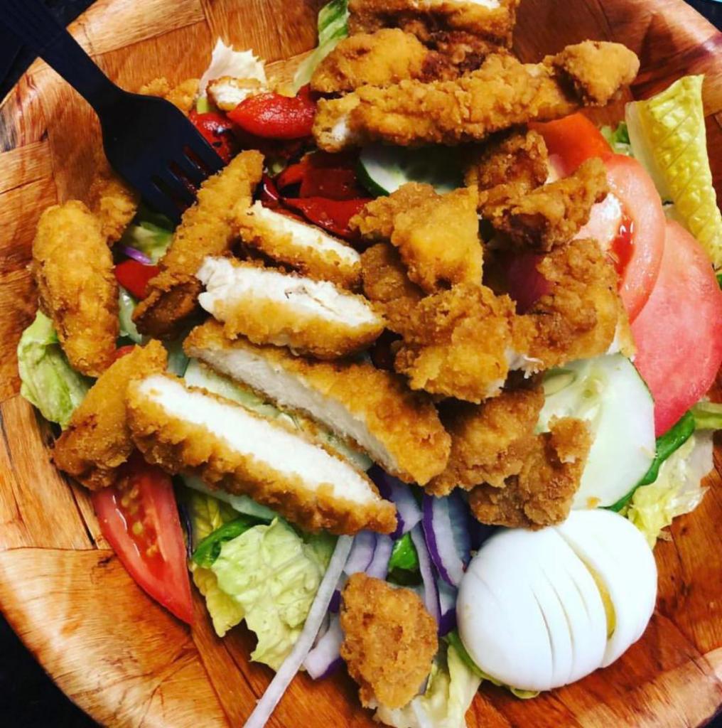 Chicken Finger Salad · Made with mixed greens, red onions, cucumbers, tomatoes, Kalamata olives, peppers and hard boiled eggs.