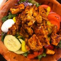 Grilled Chicken Salad · Made with mixed greens, red onions, cucumbers, tomatoes, Kalamata olives,  peppers and hard ...