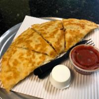 Veggie Quesadilla · Mushrooms, onions, tomato, broccoli, spinach, olives and green peppers. Made with fresh mozz...