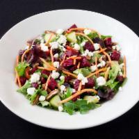 Roasted Beet Salad · Mixed greens, roasted beets, grape tomatoes, cucumbers, carrots pecans and feta cheese. Toss...