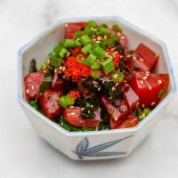 Poke Salad · Slices of tuna, cucumber, green onions, seaweed salad, ma-sago and drizzled poke sauce.