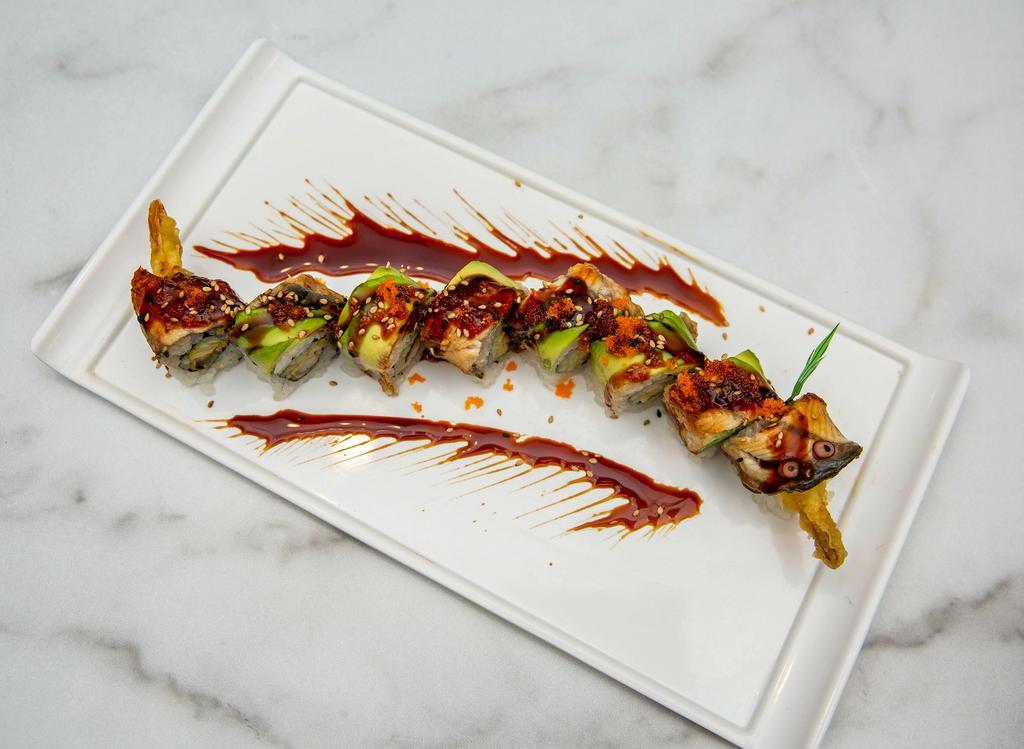 Dragon Roll 🍤 · Tempura shrimp, cucumber and topped with BBQ eel, avocado, spicy mayo, eel sauce, masago and sesame seeds.