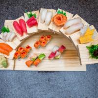 Oishii Mika Combo · 8 pieces of chef's choice nigiri, 6 pieces sashimi with Rainbow roll and Oishii Mika roll, m...