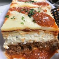 Large  Wedge Lasagna · All beef chop meat, ricotta cheese, Parmigiana cheese and marinara sauce.