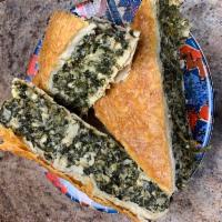 Spinach Pie · Sauteed spinach, leeks and crumbled feta cheese in a filo dough.
