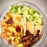 Mix Grill Platter · Chicken and beef souvlaki, rice, salad, tahini and tzatziki sauce.