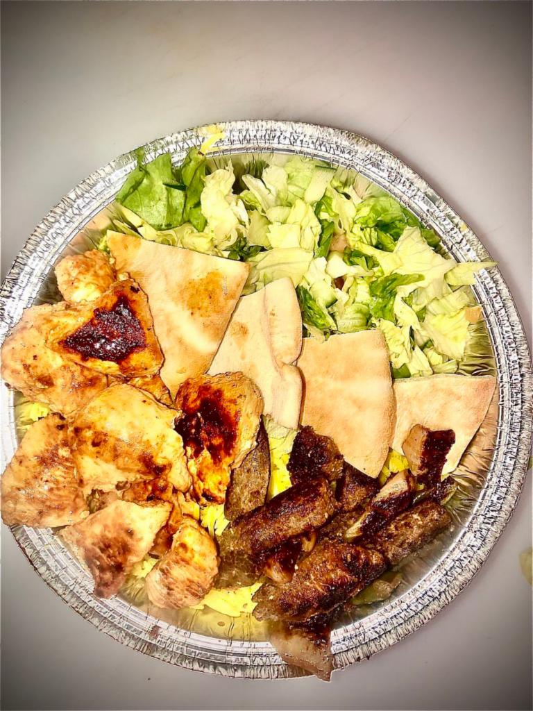 Mix Grill Platter · Chicken and beef souvlaki, rice, salad, tahini and tzatziki sauce.