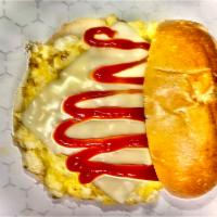 EGG & CHEESE SANDWICH  · Scrambled egg with cheese and ketchup on buns 