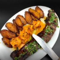 Surf and Turf · Marinated skirt steak with choice of jumbo shrimp or lobster tail.
