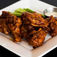 Wings · Our wings are served with Ranch or Blue Cheese dressing, celery, and either our house made m...