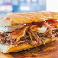 33. The Peter Luger · Hot roast beef. mozzarella, crispy bacon, caramelized onions, Peter Luger's sauce