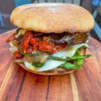 57. Veggie King  · Broccoli rabe, sun-dried tomato, grilled eggplant, provolone, caramelized onions, olive oil,...