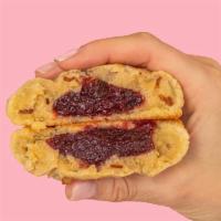 Raspberry Almond Duchess · Crispy almond cookie stuffed with delicious raspberry jam.