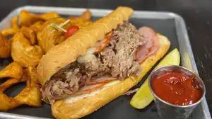 Miami Cubano Sandwich · Pulled pork, ham, and melted swiss served with spicy brown mustard.