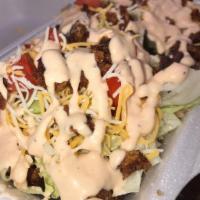 Purria Fries · Loaded alcapurria fries with your choice of meat, topped with sour cream, potato sticks and ...