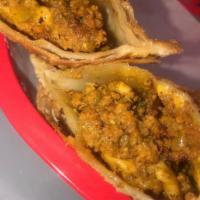 Empanadilla de Carne y queso (Beef + cheese) · Flaky turnover stuffed with beef and cheese. 