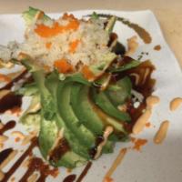Spicy Volcano Salad · Inside: Spicy Kani. Outside: Wrapped with Avocado and Masago, Eel sauce, Spicy Mayo sauce on...