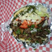 Beef Shawarma (Gyro ) · Beef Shawarma (Gyro)
 Thinly slidced grilled beef served  on Pita bread with parcly ,onion,t...