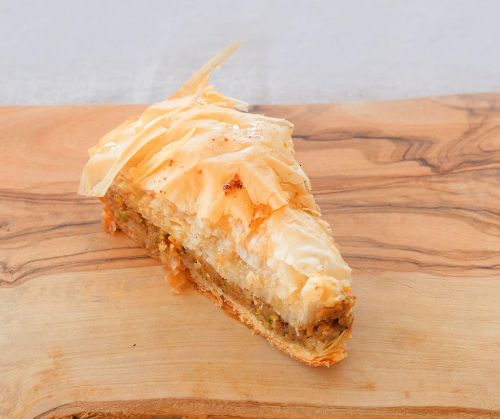 Baklava · Baklava is a rich, sweet dessert pastry made of layers of filo filled with chopped nuts and sweetened and hold ttogethere with syrup. ..