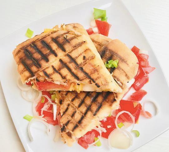 Veggie Mozzarella Grilled Panini · Fresh mozzarella, plum tomato, basil, spinach, sundried tomato, balsamic vinegar.